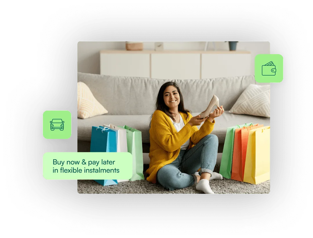 a woman sitting on the floor with shopping bags